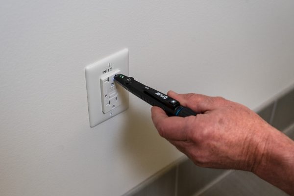 FLIR VP40 being used on a wall outlet